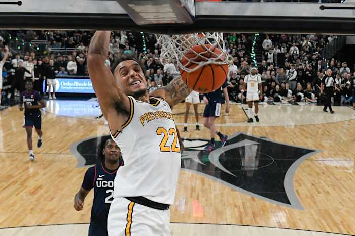Providence Friars guard Devin Carter (22) dunks the ball against the Connecticut Huskies during the first half at Amica Mutual Pavilion. 